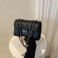 Women's retro textured diamond small square PU handbag in beige with a shoulder strap.