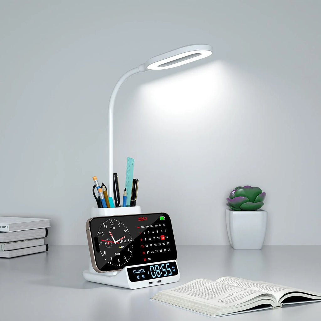 Modern black and white wireless charging desk lamp with integrated pen holder and storage box compartments.