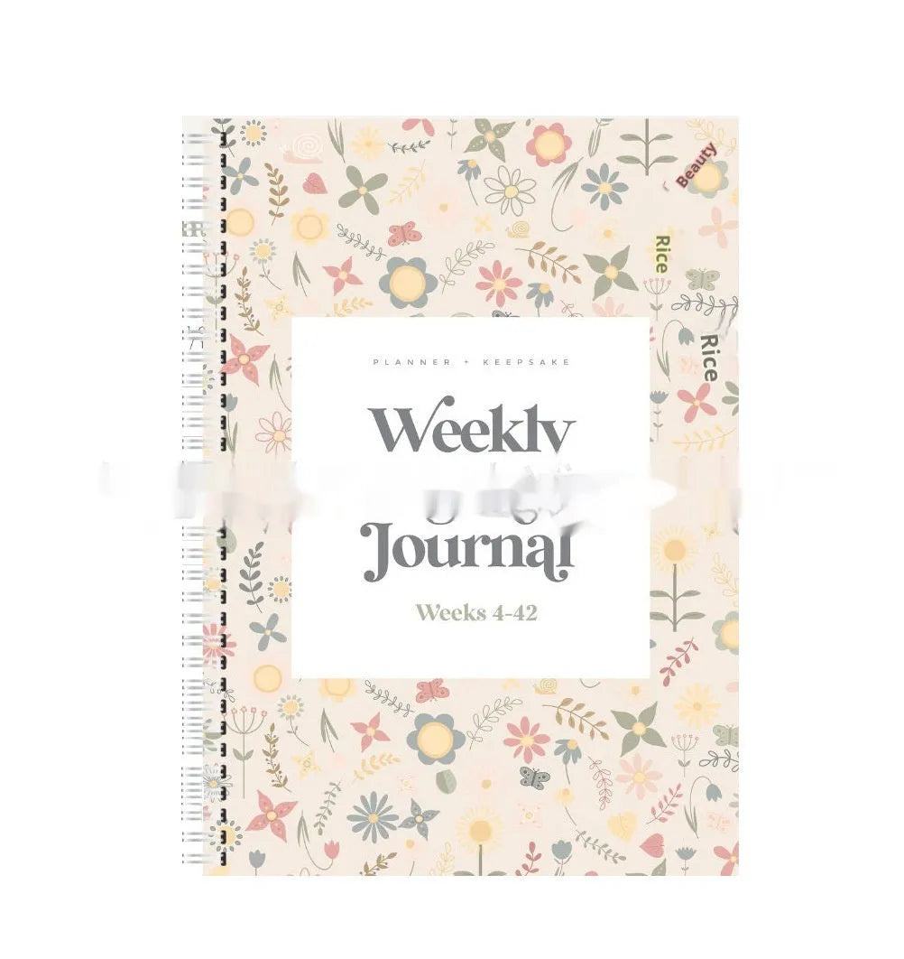 A5 pregnancy weekly diary notebook open showing weekly pregnancy tracking pages