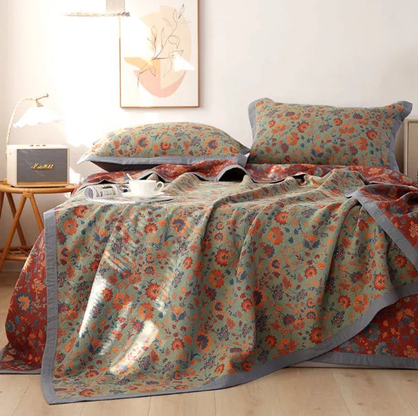 Cotton gauze bed blanket three-piece set with floral plant pattern showing blanket and two pillowcases
