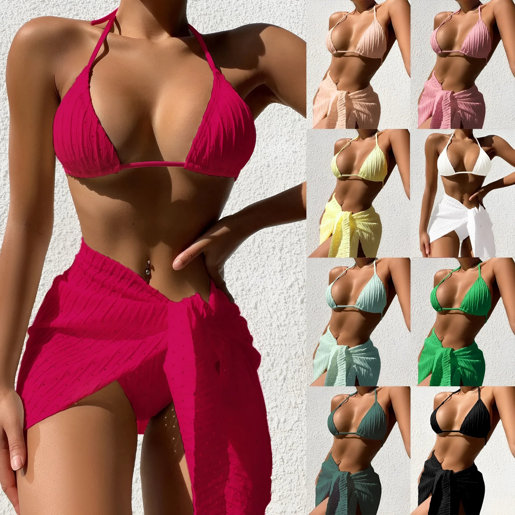 Women's black halterneck bikini with matching mesh skirt, a three-piece swimsuit set.