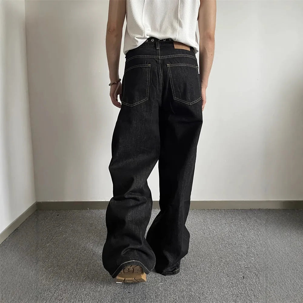 Black retro loose-fit straight-leg jeans with mid-waist and zip fly on hanger