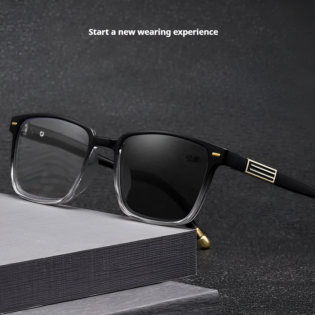 Multifocal blue light reading glasses with photochromic lenses in a black and silver frame style.