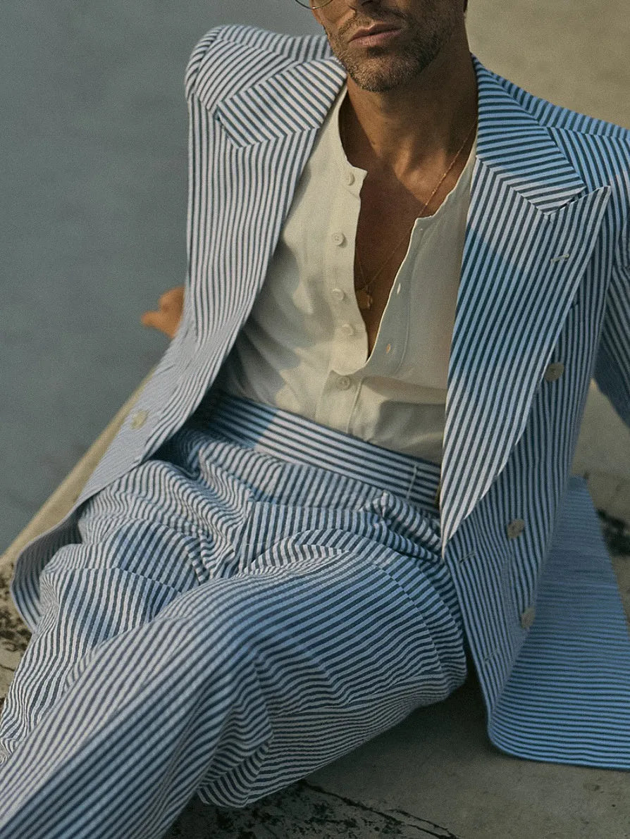 Blue and white striped polyester suit set with blazer and matching trousers