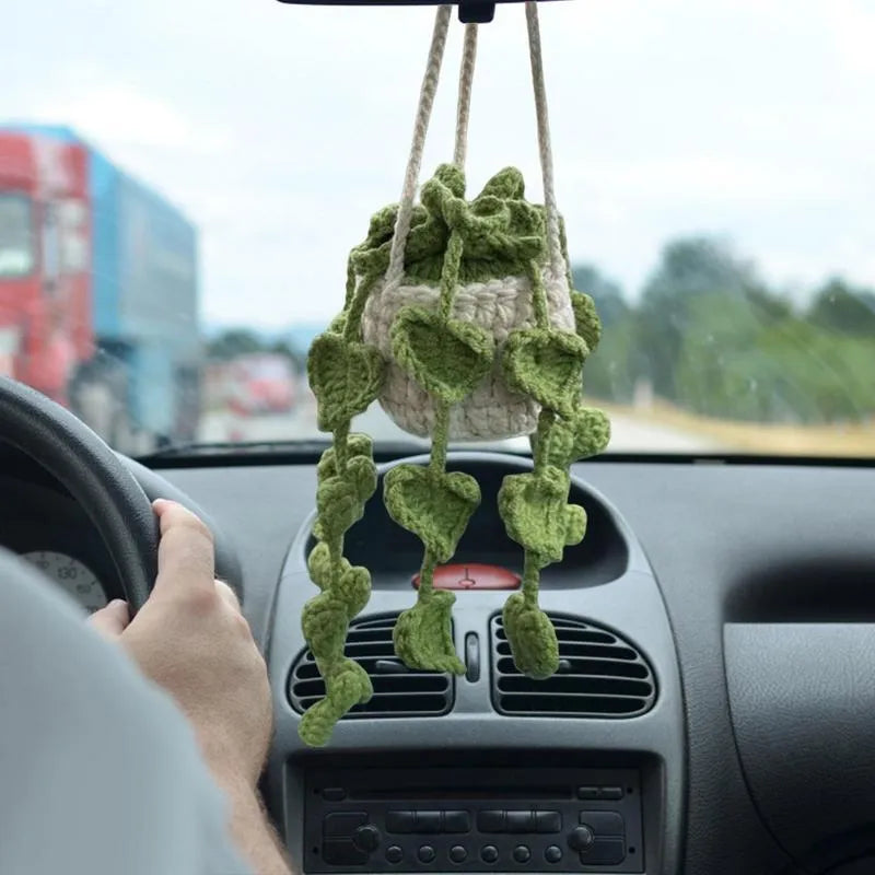 Green and white fish-scale style knitted wool car hanging planter with 8cm base and long white cord.