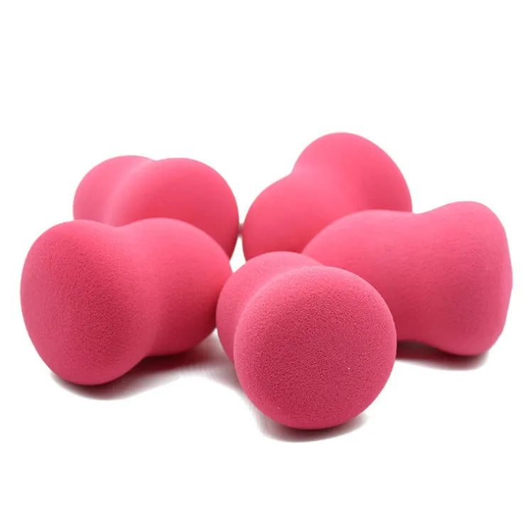 Pink non-latex makeup foundation sponge on a white background showing its 4x4x5.6cm size.
