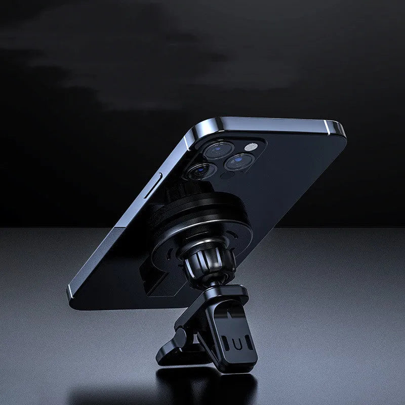 White mobile magnetic absorption wireless charger on a table next to a smartphone