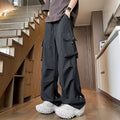 Black waterproof plus size loose straight-leg trousers with a drawstring waist on a hanger.