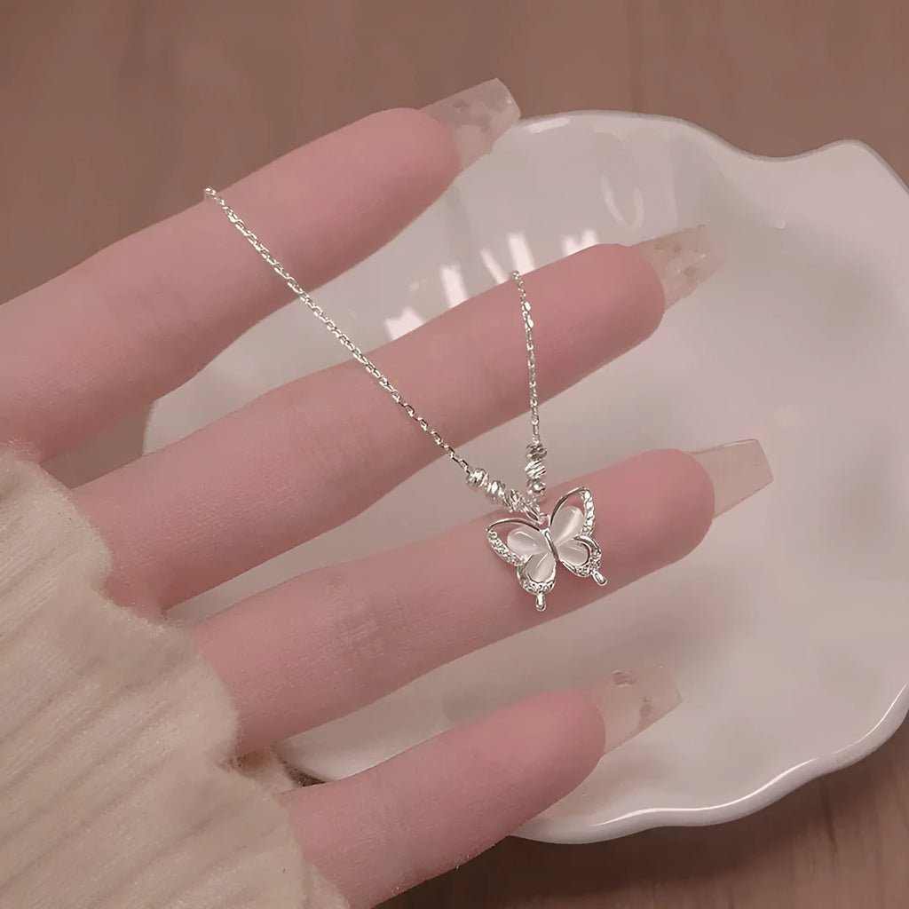 Silver butterfly necklace with square opal pendant on adjustable cross chain