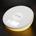 White slim QI wireless charger with LED clock display for mobile phones.