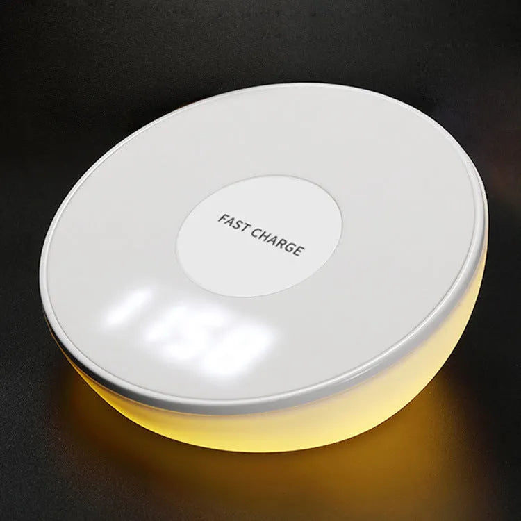 White slim QI wireless charger with LED clock display for mobile phones.