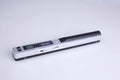 Handheld barcode scanner in choice of colours for shop stock control.