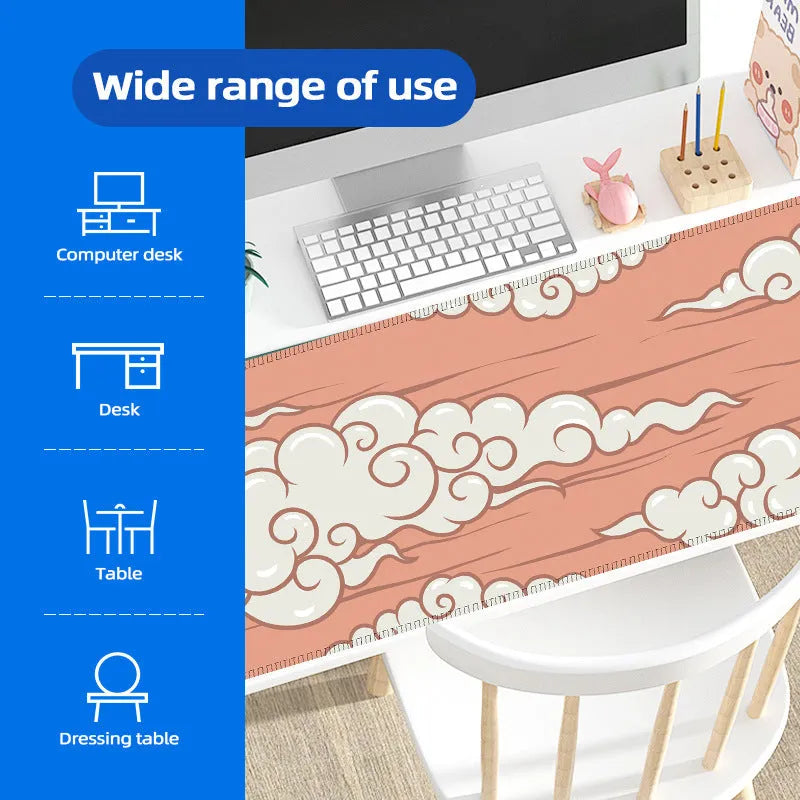 Large cloud pattern mouse pad with non-slip rubber base on a desk