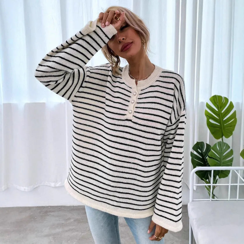 Black and white striped women's loose top with drop-shoulder sleeves and button detail