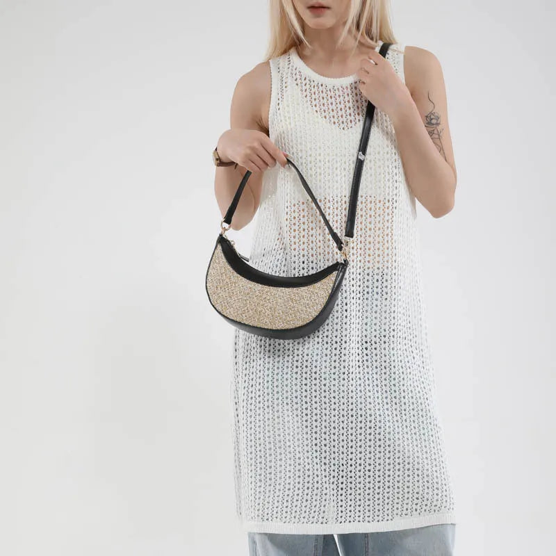 Women's hard straw dumpling-shaped crossbody bag in multiple colours with contrast stitching and internal organiser pockets.