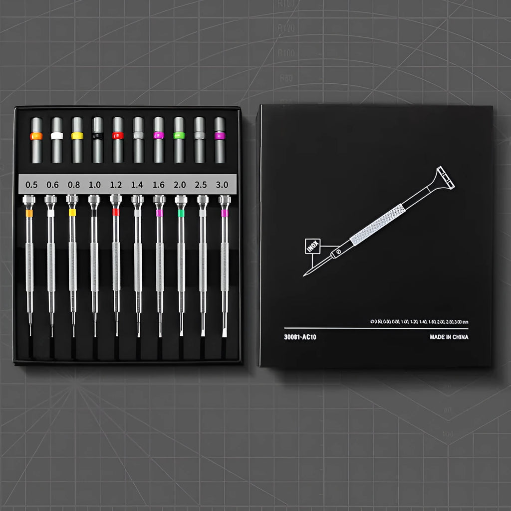 Boxed set of 10 manual screwdrivers and spare bits for watch and glasses repair.