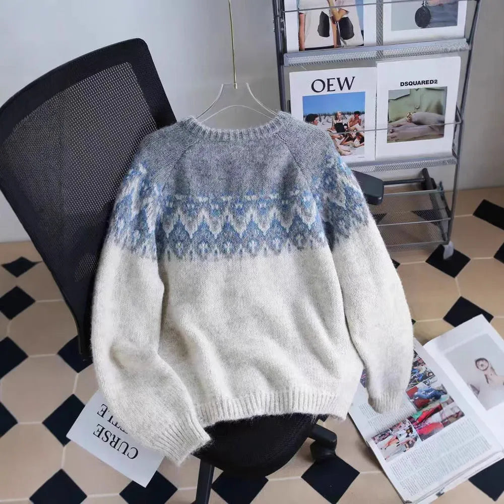 Women's loose-fit jacquard knit sweater coat in beige, shown with long sleeves.