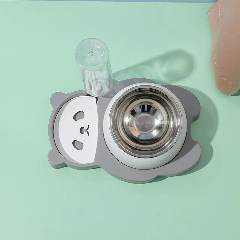 Grey and green panda-shaped automatic water dispenser with tilted stainless steel pet bowls.