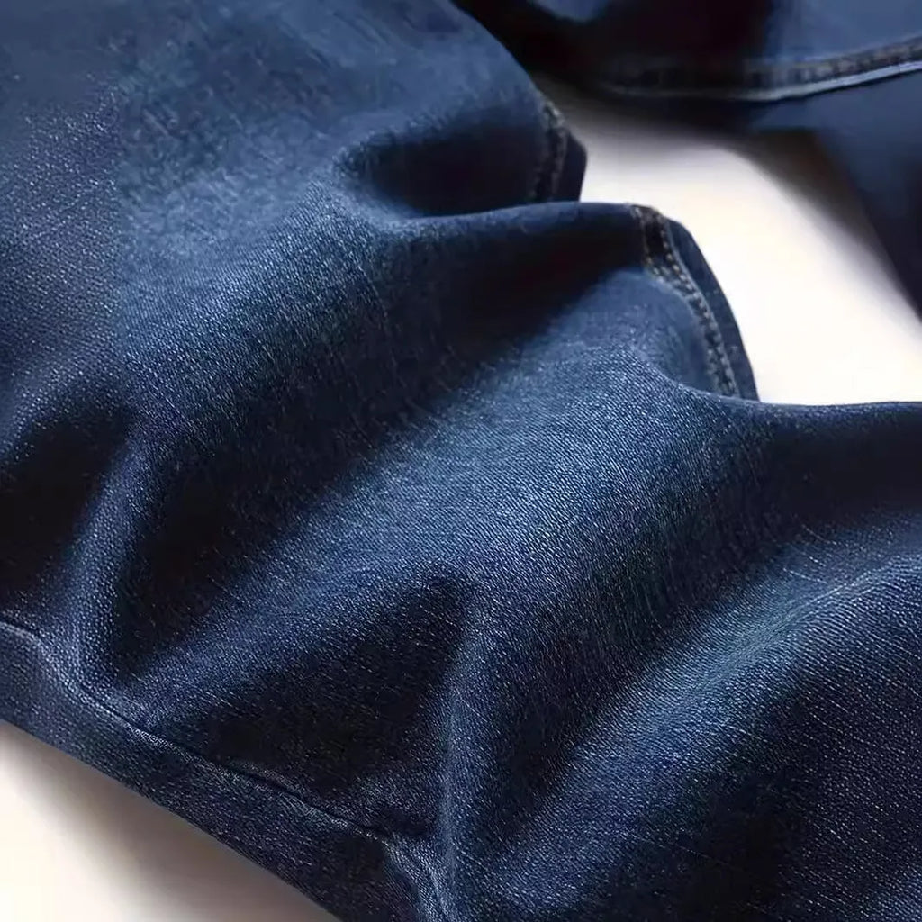 Dark blue men's slim fit casual jeans with medium elastic cotton construction