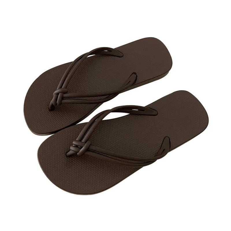 Men's PVC toe-covering flip flops in beige colour on a plain background.