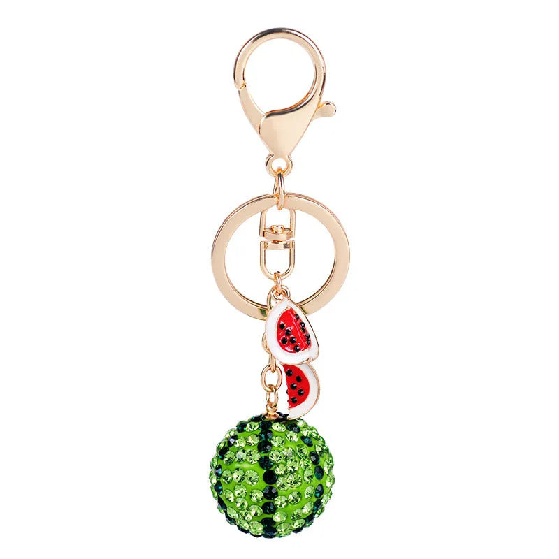 Green watermelon-shaped zinc alloy keychain measuring 12 cm in length