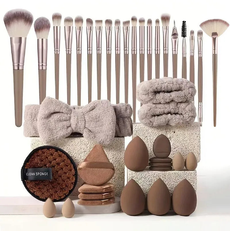 Beauty tool set with multiple pieces in brown, pink and purple colours for face wash and makeup application