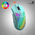Free Wolf X2 wireless RGB gaming mouse with honeycomb shell in yellow colour on a desk.