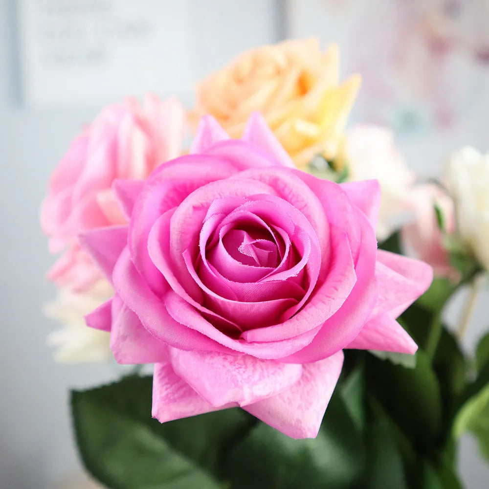 Artificial silk rose flower with red petals and green plastic stem measuring approximately 42cm long