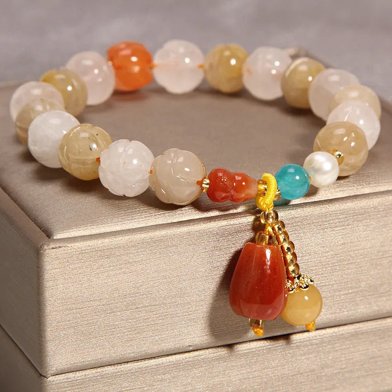 Khaki yellow agate crystal bracelet for women with gold silk threading.
