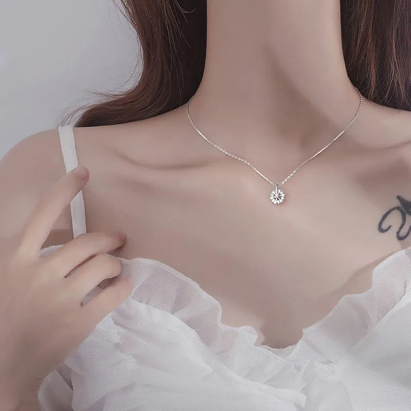 Pure silver rotating snowflake necklace with electroplated finish on adjustable cross chain for women