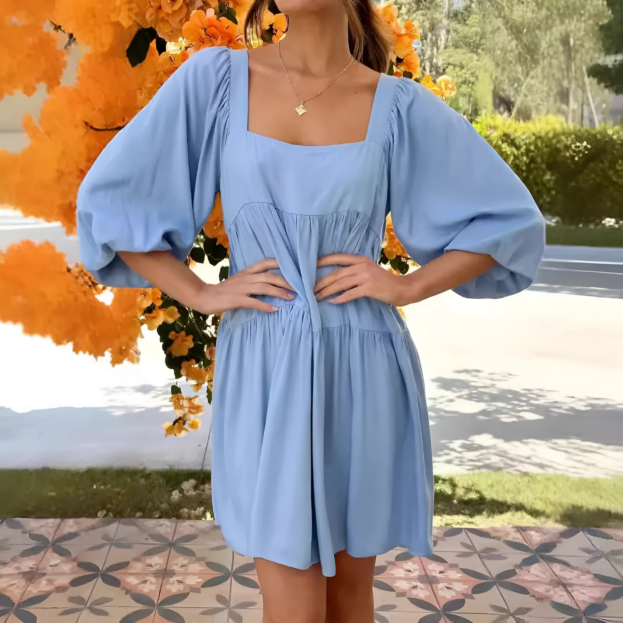 Girl in a light blue square collar puff sleeve backless A-line summer dress.