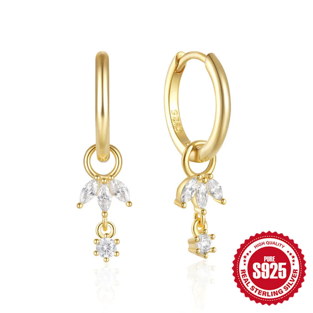 A pair of S925 sterling silver geometric earrings featuring a sunflower design with inlaid golden zircon stones.