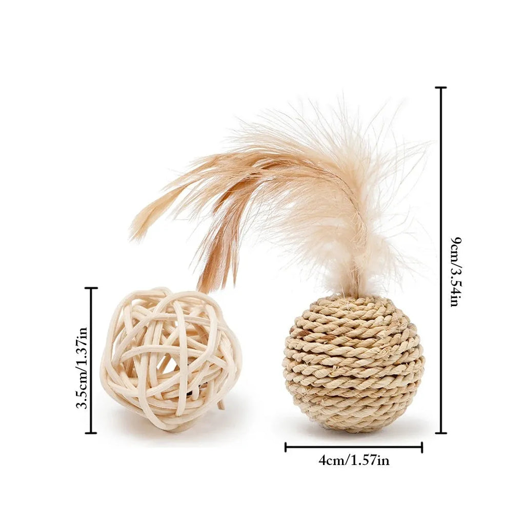 Two cat toys: hollow rattan ball and faux feather ball with bell on wooden floor