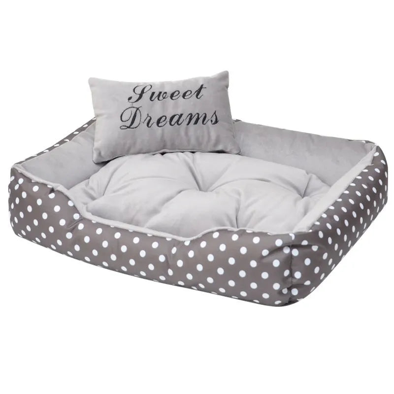 Small polka dot print square dog bed with a matching square pillow inside, shown in grey colour.