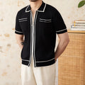 A black slim-fit lapel polo shirt with short sleeves, made from a thin knitted fabric.