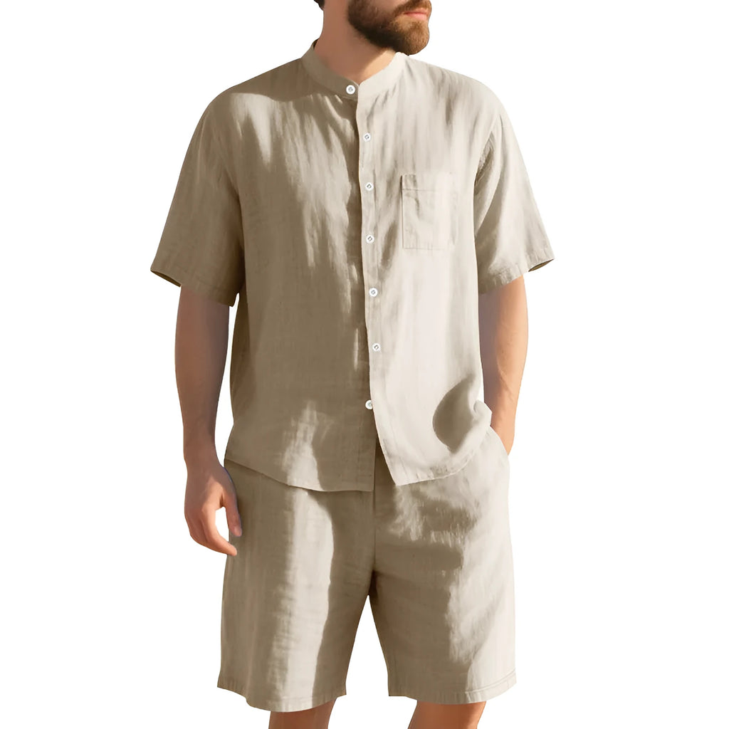 Men's light blue linen blend summer suit with henry collar shirt and shorts on a hanger.