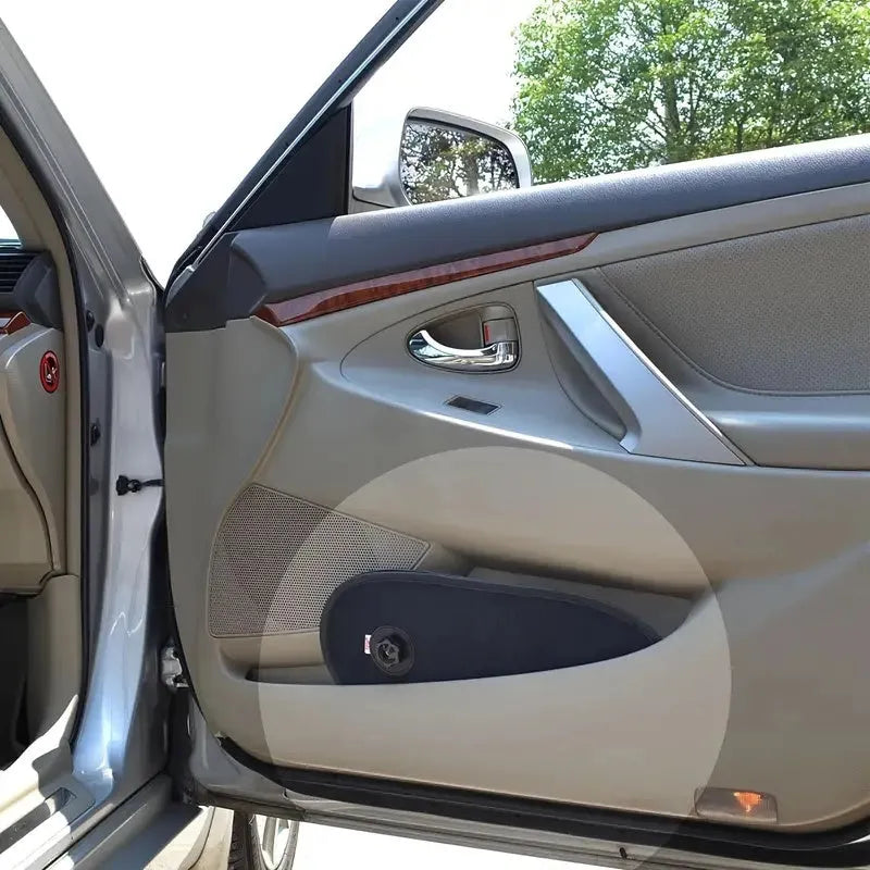 Black stretchy car window shade with suction cups attached to vehicle side window