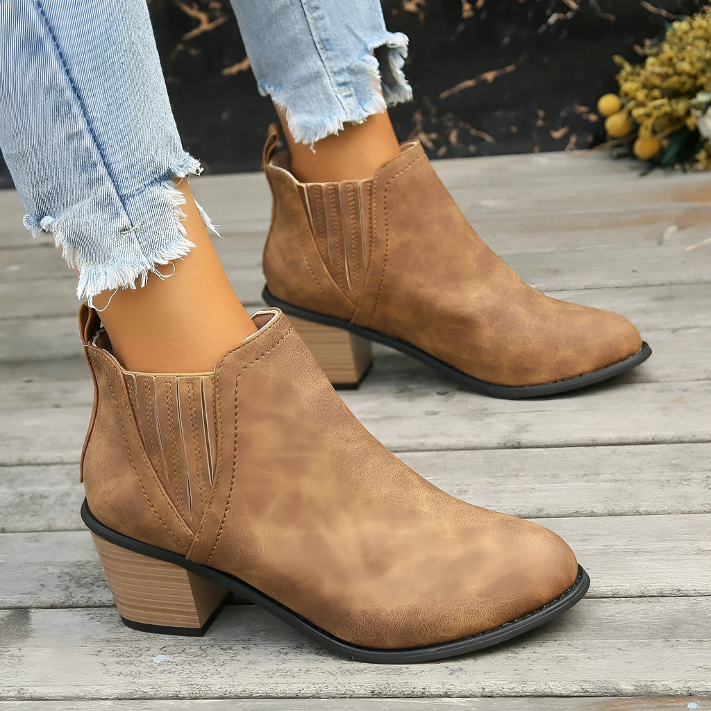 Women's black ankle boots with pointed toe and thick square heel design for autumn winter wear