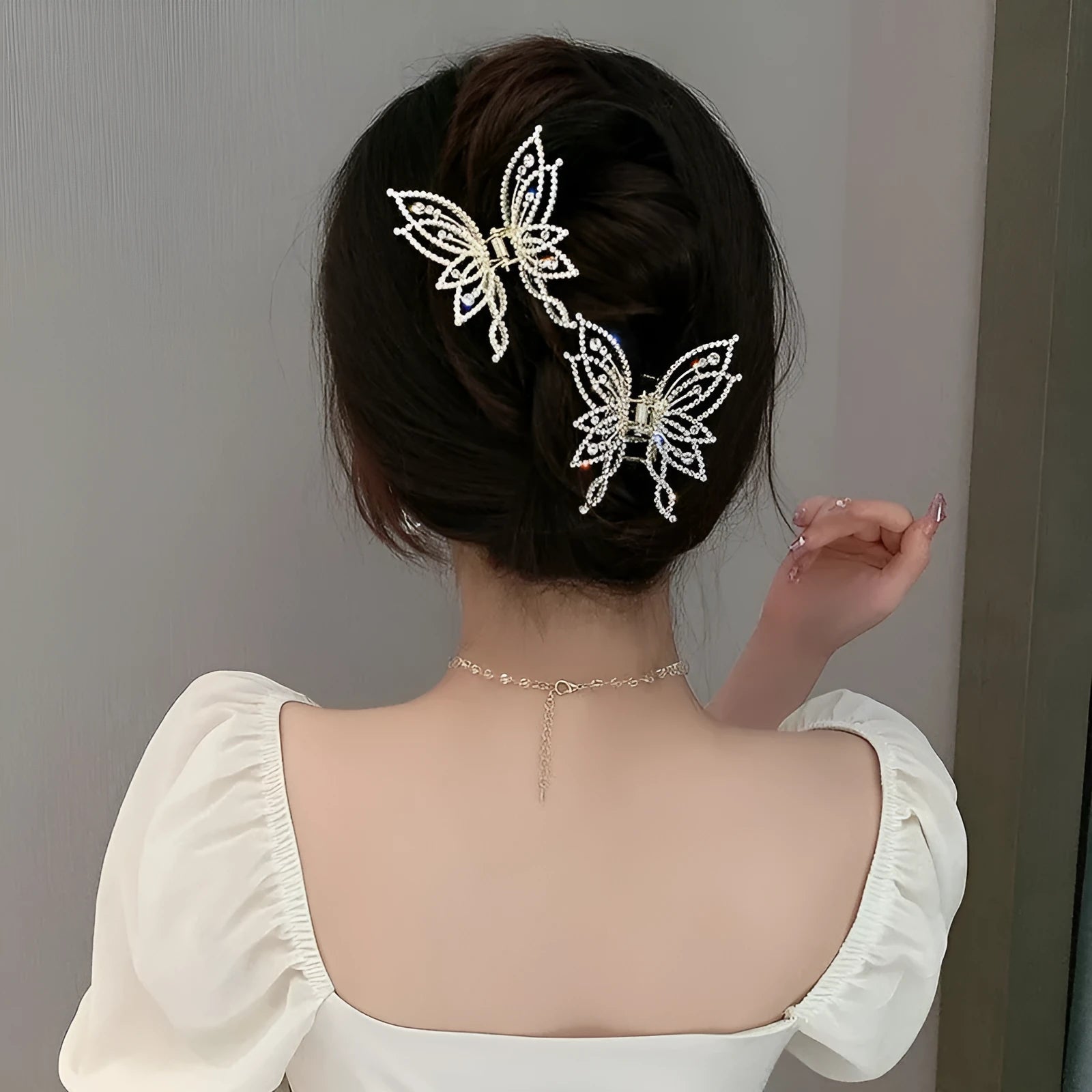 Butterfly design hair barrette for women with alloy construction and decorative rhinestone or pearl styling