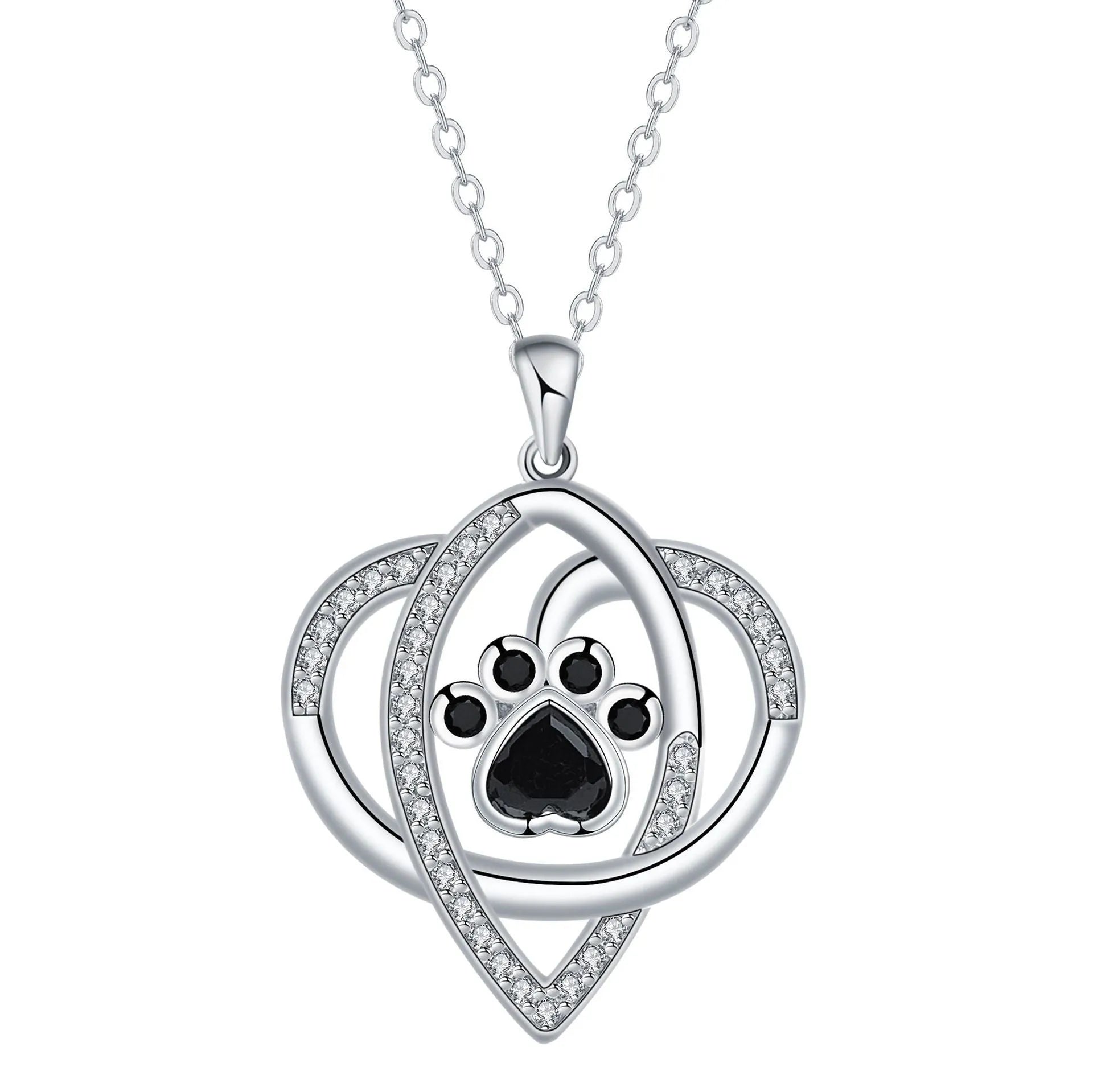 Close-up of a dog's paw print copper pendant necklace on a cross chain.