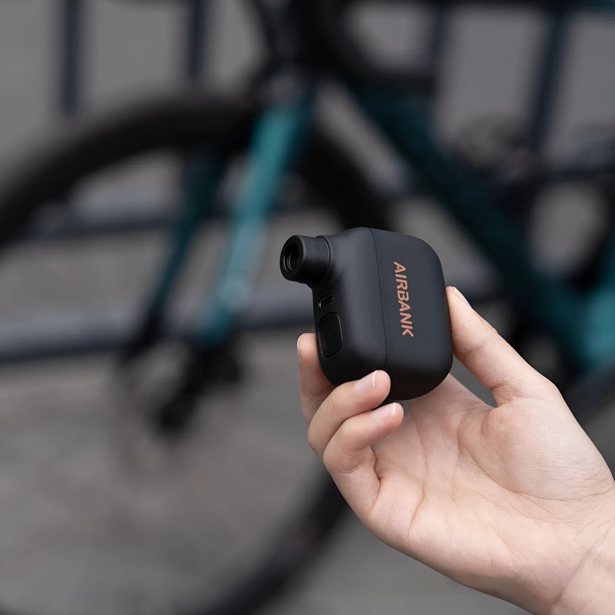 Black AS100 mini electric bicycle inflation pump with USB charging cable