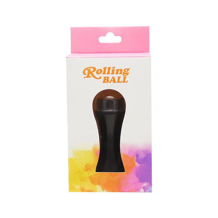 Portable volcanic stone oil absorbing roller in pink on a white background.