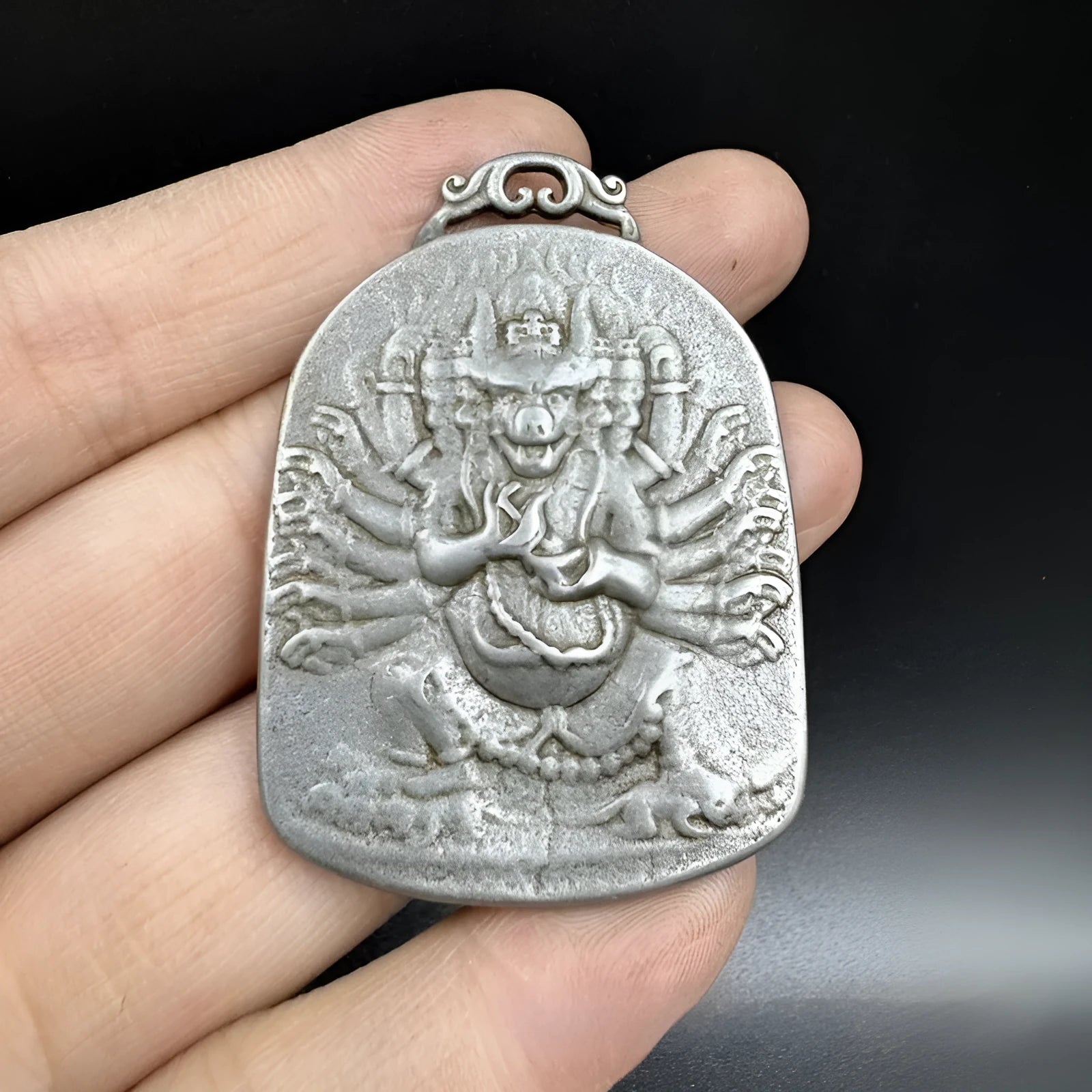 Iron metal pendant with Chinese geometric design depicting Yamantaka Aryaacalanatha deity