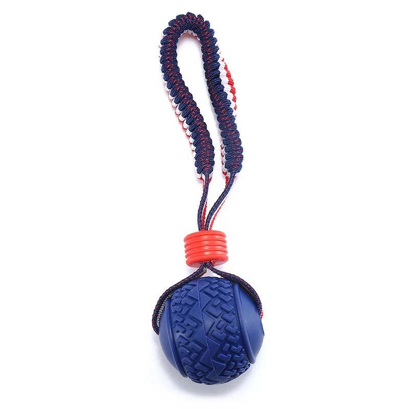 Blue dog ball with rope toy showing textured rubber surface and rope handle for tug-of-war games