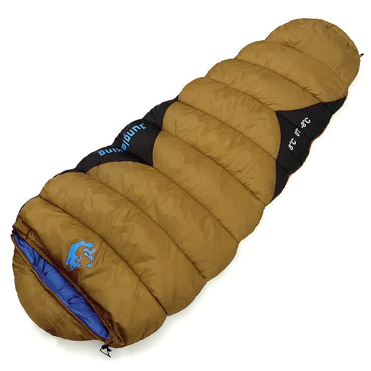 Cotton sleeping bag in Army Green colour compressed inside its storage bag alongside the unfolded sleeping bag.