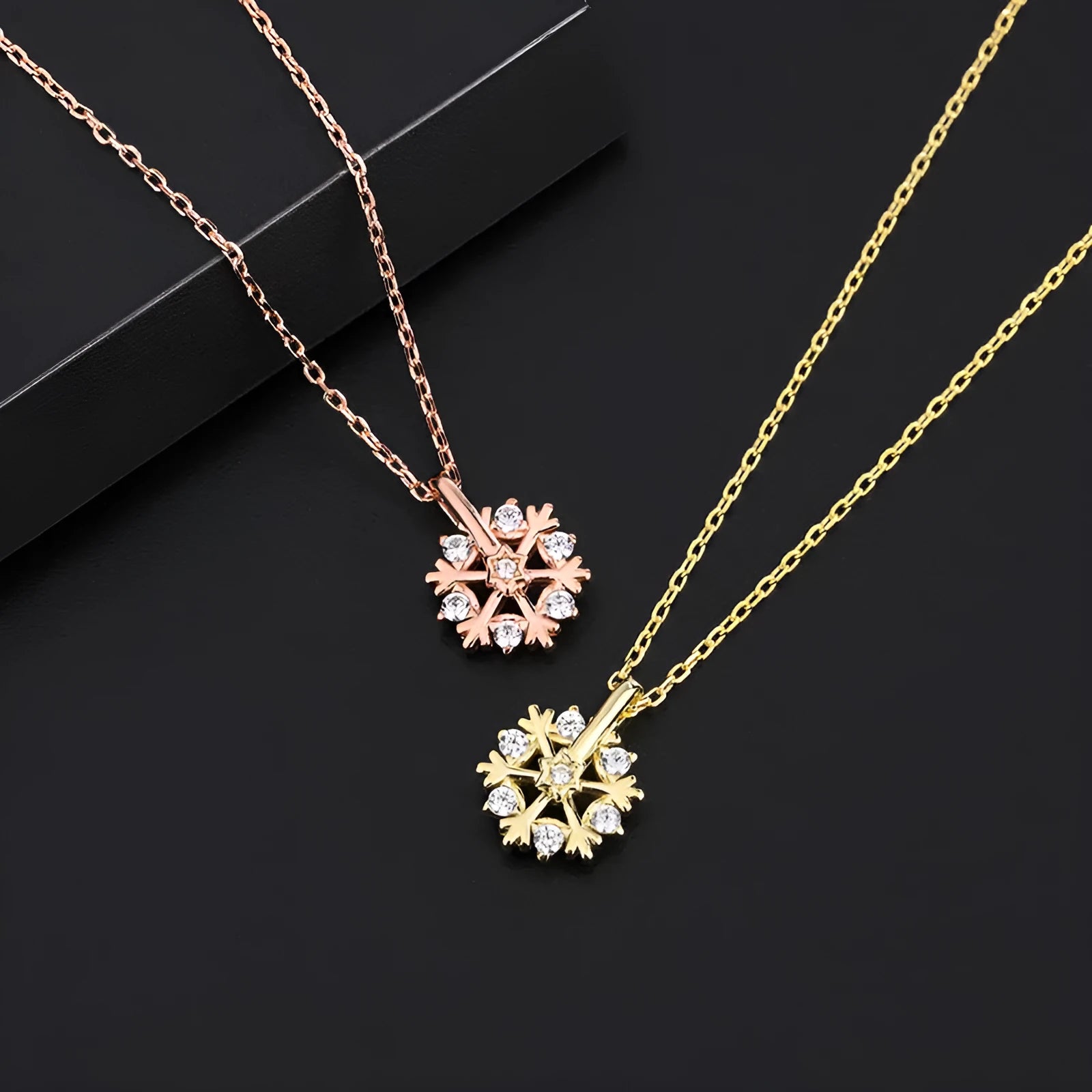 Pure silver rotating snowflake necklace with electroplated finish on adjustable cross chain for women