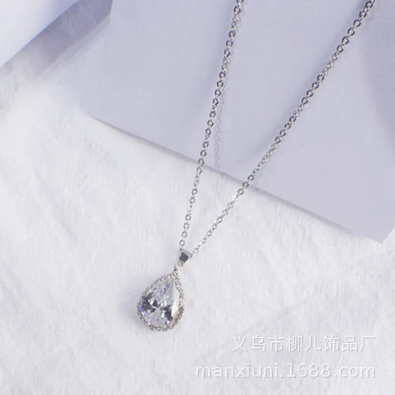 Pink rose gold drop shape rhinestone necklace with geometric design on alloy chain