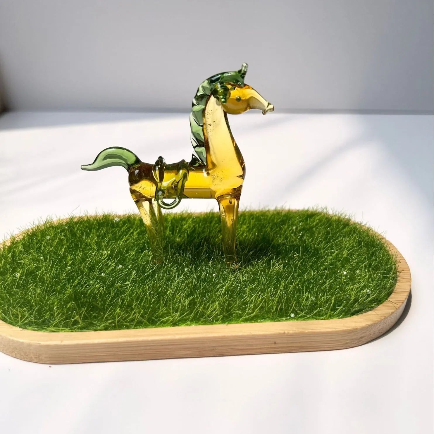 Glazed ceramic horse figurine decoration in modern simplicity style on a desk.