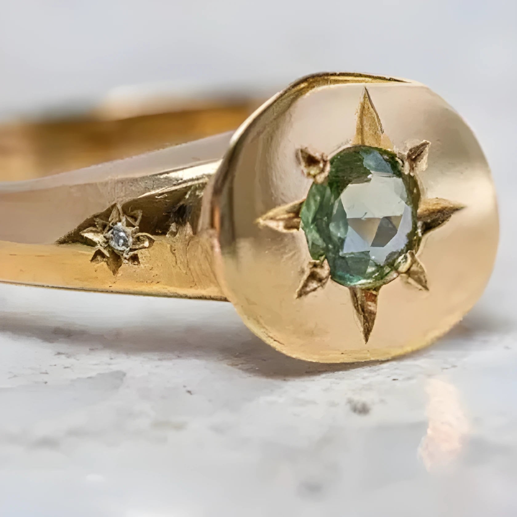 Gold-coloured adjustable ring with a detailed star and oval asterism zircon design.