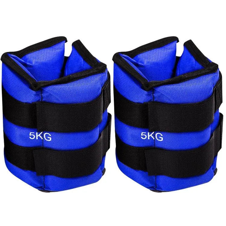 A pair of black Oxford cloth legging sandbags with straps, shown with weight options from 1kg to 6kg for athletic training.